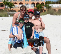 image of Pete and Jan with James, Will and Charlie on the beach