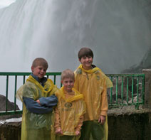 image of James, Will and Charlie in rain gear at Niagara Falls