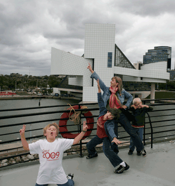 James, Will, Charlie, and Mom on S.S. Mather w/Rock and Roll Hall of Fame in background