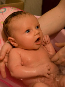 baby girl's first bath at home