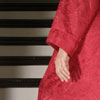 woman in red robe on stairway