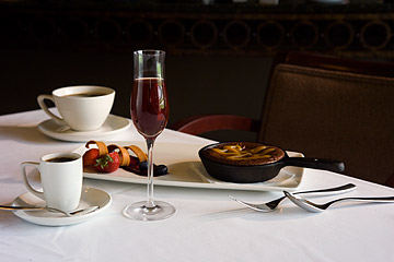 Photo of dessert plate with strawberries and chocolate.