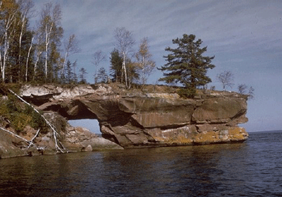 image of rocky cliff extending into lake superior around Apostle Islands in Wisconsin 

USA