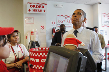 President Obama orders food at a local Five Guys Burger and Fries Restaurant