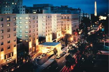 a night photo of the Fairmont Hotel in Washington D.C.