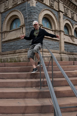 Mike Thomas having fun sliding down a railing at The Cuyahoga County Soldiers' and Sailors' Monument