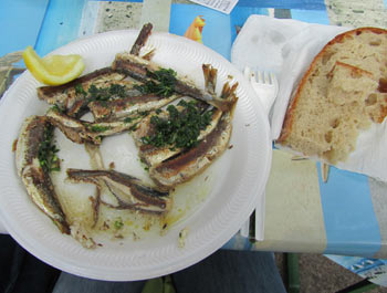 Sardines, in olive oil, parsley, and garlic, served with fresh-baked bread.