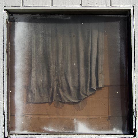 Store window with cloth inside