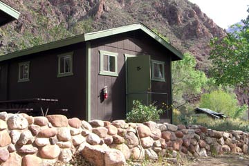 Small brown wooden cabin, Dorm #12