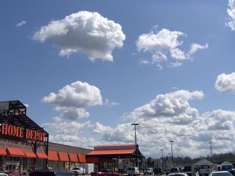 White  clouds, blue sky over Home Depot