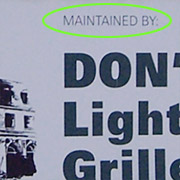 Sign showing the words "Maintained by" in tiny letter