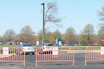 Barriers in parking lot with "no parking" signs on them