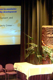 Tri-C theater stage with tiki and PowerPoint