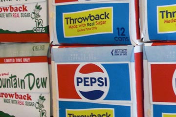 Cases of Pepsi and Mountain Dew Throwback edition