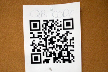 Flyer with QR code on bulletin board