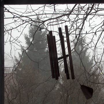Chimes on back deck blowing in the wind