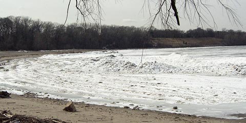 Piles of ice on Lake Erie near beach