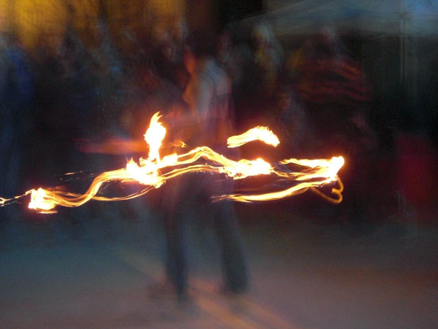 People juggling flaming stuff