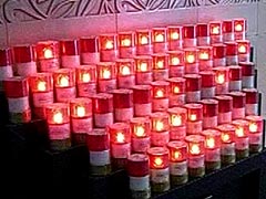 Red flickering candles in the mausoleum