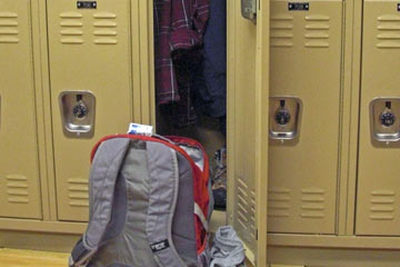 Backpack and clothes in locker