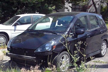 Front view of Honda Fit with missing front bumper