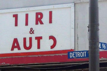 Store sign with parts of letters missing