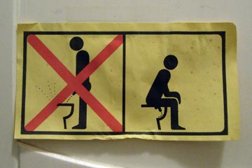 Sit to pee sign