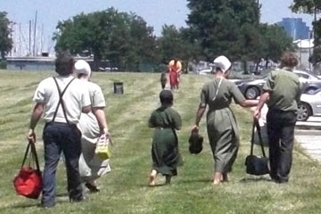 Small group of Mennonite men and women walking
