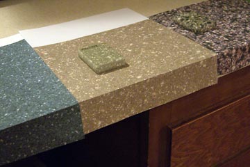 Paper samples of Avonite on kitchen counter