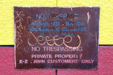 Rusty No Trespassing sign