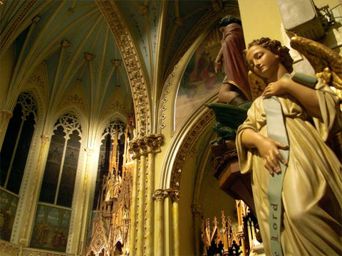 Ornate carvings and statues inside church