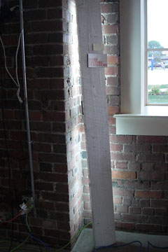White plank in corner with light behind